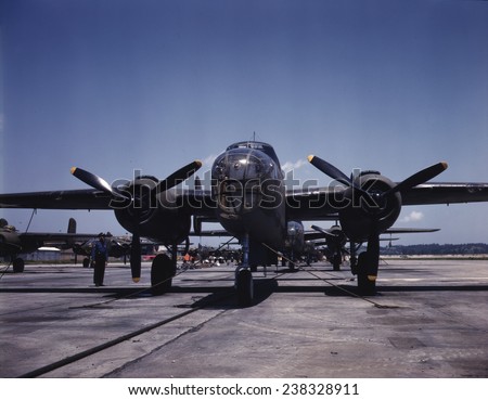 World War II, B-25 bomber planes on the outdoor assembly line at North America Aviation Inc., ready for test flight, photograph by Alfred T. Palmer, Kansas City, Kansas, October, 1942.
