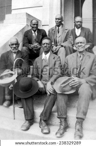 African American ex-slaves sitting,'Attendants at Old Slave Day', Southern Pines, North Carolina, April 8, 1937.