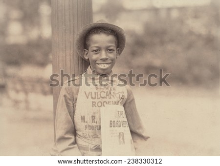 African American newsie,\'Roland, eleven year old negro newsboy\', Newark, New Jersey, photograph by Lewis Wickes Hine, August 1, 1924.