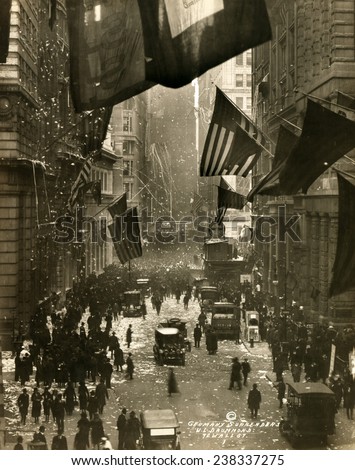 Old Glory. Flags wave over Wall Street, New York City in celebration of the surrender of Germany and the end of the Great War. W.L. Drummond, photographer, Dec 5, 1918