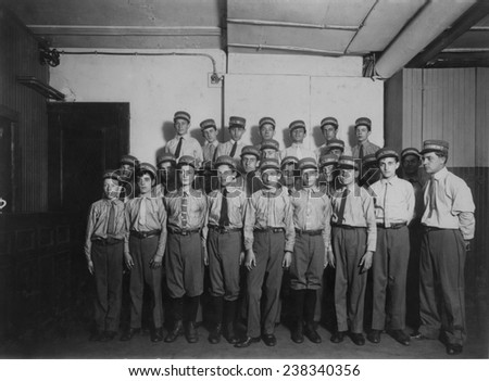 Group of messenger boys, \'A typical group of messengers at Postal Telegraph Company\'s main office, 253 Broadway...\', Broadway near 40th St., New York City, photograph by Lewis Wickes Hine, July, 1910