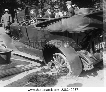 Auto accident, closeup of a car accident, photograph circa 1918-1920.