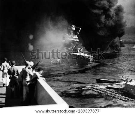 Pearl Harbor: Battered by aerial bombs and torpedoes, the U.S.S. California is evacuated as sailors and soldiers look on, December 7, 1941
