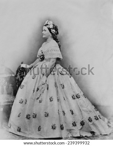 Mary Todd Lincoln (1818-1882), as First Lady, in embroidered ball gown with flowers in her hair. Photography by Brady.