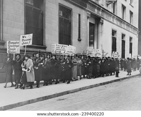 Unemployed single women in New York demonstrate for public works jobs. Some placards read \
