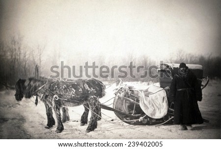 George Kennan (1845-1924), American writer, in furs next to a Siberian posting sledge on a cold morning. The American journalist published \