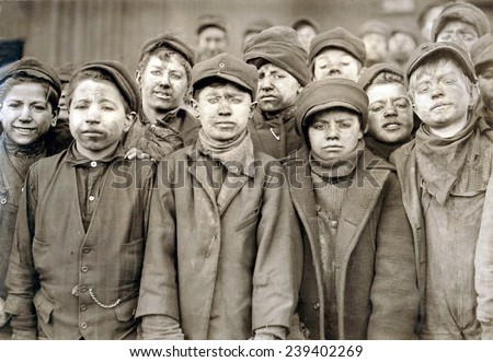 Child laborers portrayed by Lewis Hine in 1911. Dust covered Breaker boys at Pennsylvania Coal mine, used hammers to \