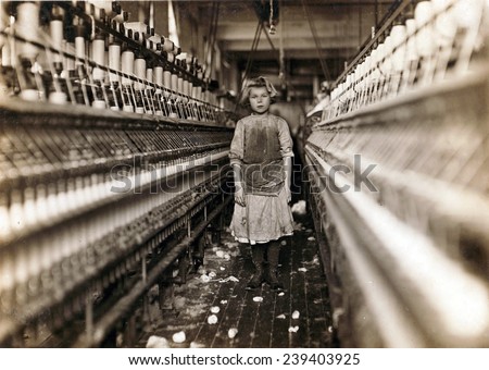 Child laborer portrayed by Lewis Hine in 1909. Little spinner who regularly worked in cotton mill in Augusta, Georgia.