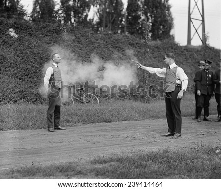 Washington, D.C. law enforcers test a new bullet proof vest in 1923.