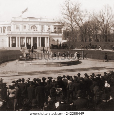 The White House in Washington, D.C., as horse drawn carriages arrive with guests for Alice Roosevelt\'s wedding to Ohio Representative Nicholas Longworth. February 1906.