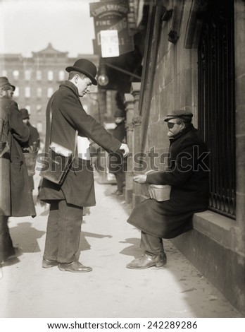 Disfigured man begging on the street in New York City, 1910.