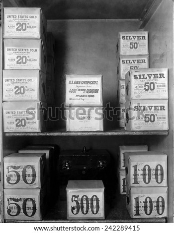 Cash vault of the United States Treasury holds packages of Gold and Silver certificates worth over 80 million dollars. In 1914, the U.S. was on a bimetallic standard.