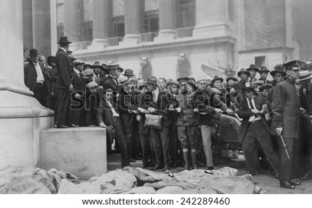 The Wall Street Bombing. Soldiers and police form a line at door of the Morgan Bank while bodies are lying in the foreground. Wall Street, in front of the Sub Treasury (Federal Hall). Sept. 16, 1920.