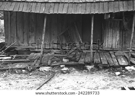 Porch of a barely standing home of a poor farmer in Boone County, Arkansas. New Deal relief and loan programs offered poor farmers medical care. Ben Shahn photo, Oct. 1935.