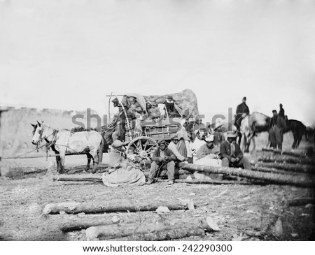 Arrival of an African American family in a Union army camp in January 1863, horse drawn covered wagon. Photo by David B. Woodbury of January 1, 1863, day Emancipation proclamation went into effect.