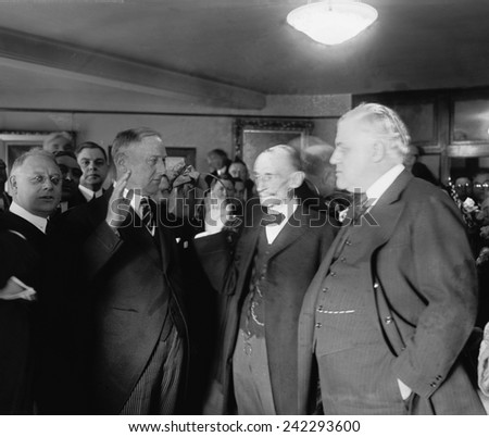 Harry M. Daugherty (1860-1941 ), at left, being sworn in as Attorney General, the day following Warren G. Harding\'s inauguration, March 5, 1921