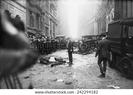 The Wall Street Bombing. A man stands over a dead horse, after the explosion in front of J.P. Morgan & Co. office at Broad and Wall Streets. Sept. 16, 1920 anarchist bombing.