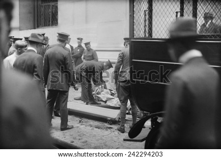 The Wall Street Bombing. Police and soldiers attend to the dead and injured after the Wall Street terrorist bombing, Sept. 16, 1920, in the New York City financial district.