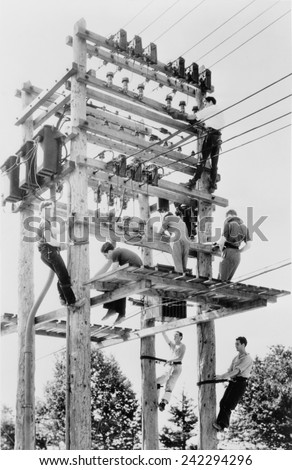 Young men working on telephone poles in Maine. National Youth Administration provided vocational training under the New Deal. 1939.