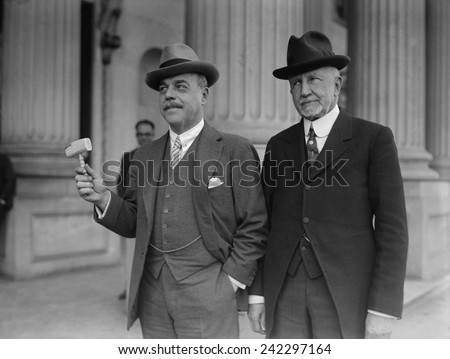 Frederick Gillette, leaving his position as Speaker of the House of Representative for a Senate seat, hands his gavel to Nicholas Longworth, the new Speaker. Feb. 28, 1925.