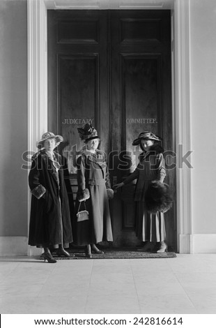 Women suffragists at the doors of the House Judiciary Committee in the House Office Building. 1916.