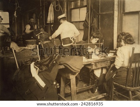 Workers in a cramped New York City garment sweatshop in 1908. Photograph by Lewis Hine.