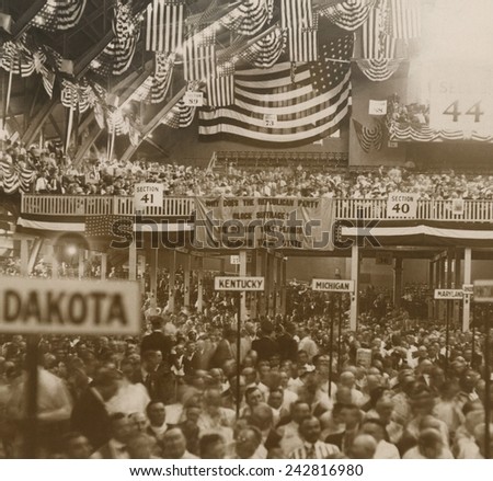 Republican Convention in Chicago, June 1920. In the background, a National Women\'s Party banner reads, \'Why does the Republican Party Block suffrage? We do not want planks. We demand the 36th state.\'