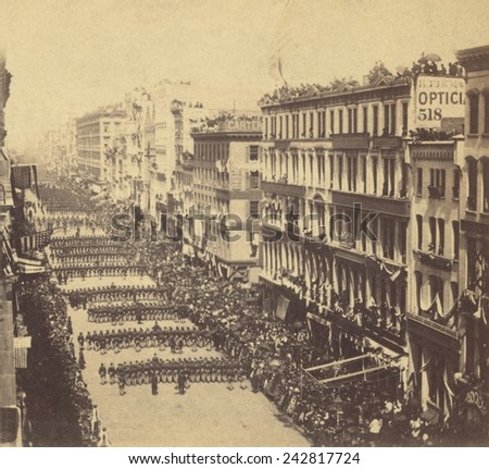 Marchers in Lincoln\'s New York funeral procession proceeding down Broadway away from the viewer ca. 1865.