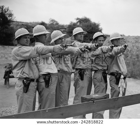 The guns that protect the President. Members of the White House police force that are taking part in the third annual marksmanship match. August 2, 1938.