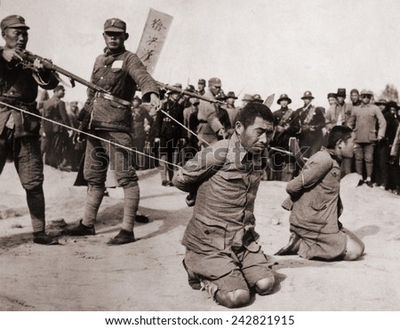 Two Chinese men kneeling prior to execution by Chinese soldiers. The Sino-Japanese war (1937-1945) Fight against the Japanese occupation as well as a civil war between the Nationalists and Communists.