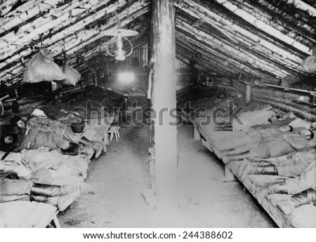 Russian convicts\' sleeping quarters in a primitive Siberian prison camp barracks. Khabarovsk area in far eastern Russia near the Chinese border. Ca. 1895 photo by William Henry Jackson.