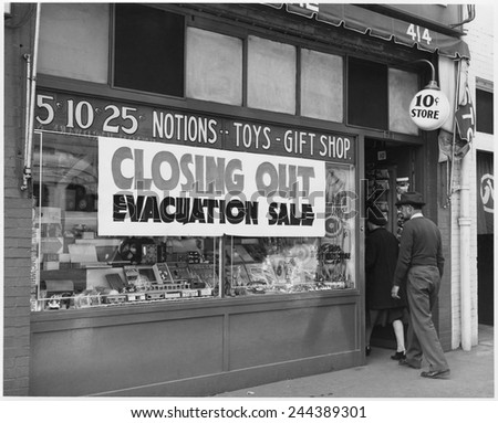 'Evacuation Sale' sign on a Japanese-American store in preparation for World War II relocation. Internees were given little notice and forced to abandon or sell their businesses at heavy losses.