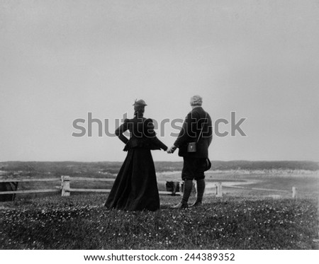 Alexander Graham Bell and Mabel Hubbard Bell hold hands and look toward the sea from Sable Island, Canada in 1898. Mable lost her hearing from scarlet fever at age five.