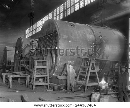 Steam ship boilers under construction in Wyandotte, Michigan in 1912. The massive coal fired boilers were 14\' in diameter.