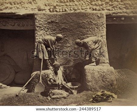 Using centuries old methods, men smelting iron ore in a primitive forge to make cast-iron in Turkestan, Central Asia. Between 1865-1872.