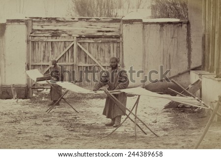 Using pre-industrial methods, two men prepare a warp for cotton cloth in Taskestan ca. 1870.