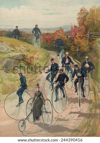 Cycling in the country. Several men on high rider bicycles and one woman on a three-wheel cycle ride on a dirt path in an autumn landscape. 1887.