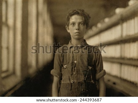 Jo Bodeon, a child laborer in the Chace Cotton Mill of Burlington, Vermont worked in the spinning mule room. May 1909 photo by Lewis Hine.
