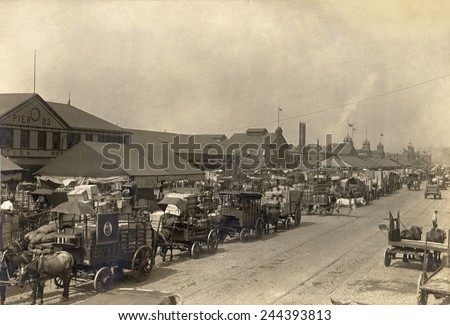 Horse drawn wagons crowd New York piers and warehouses to stock up on food in preparation for a threatened railroad strike. August 1916.