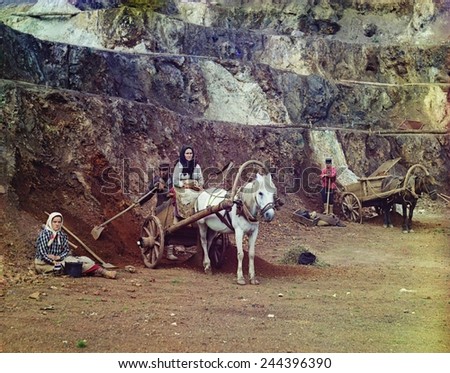 A family, with shovels and horse-drawn carts, working at the iron mines in the Bakaly Hills of Russia\'s Ural Mountains. 1910 special process color photo Sergei Prokudin-Gorskii.