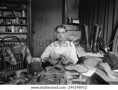 Traditional shoemaker in his workshop is Tony Bruno of Washington, D.C. who made and repaired shoes for presidents and politicians. 1925.