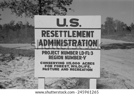 US Resettlement Administration sign for the Withlacoochee Land Use Project. Reforested the area established recreation facilities fire control and telephone communications. Florida Jan 1937.