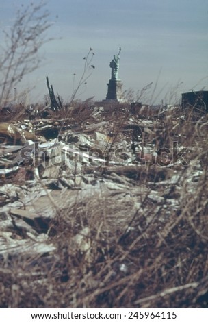 Dump in New Jersey with a view of the back of the Statue of Liberty in New York Harbor. This landfill was developed into Liberty State Park which opened June 14 1976. Ca. 1973-75.