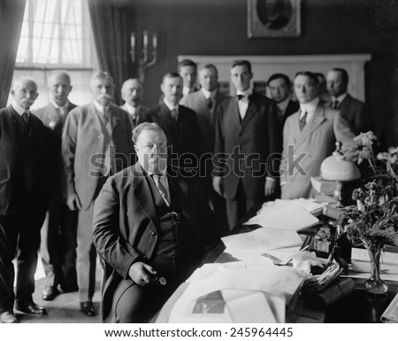 President William H. Taft at his desk in the Oval Office he had built centered in the south side of the West Wing of the White House. The room had Georgian Revival details and green walls. Ca. 1910.