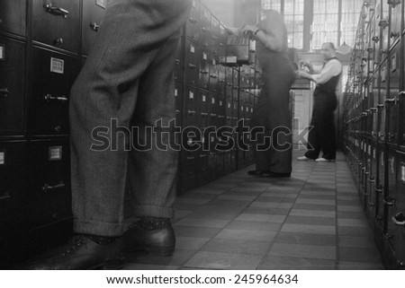 Federal Government office workers searching files in Washington D.C. 1939.