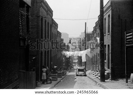 Street in Pittsburgh's 'Hill' district. The African American section was one of the poorer sections of the city but had an active arts and civil culture. July 1938 photo by Gordon Parks.