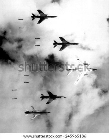 Bombing North Vietnam. US Air Force F-105 Thunderchief bomb a military target through low clouds over the southern panhandle of North Viet Nam. June 14,1966.