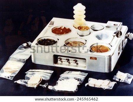 Skylab food heating and serving tray with food, drink, and utensils. The food on Skylab was a great improvement over liquefied food from plastic tubes of earlier spaceflights. 1970.