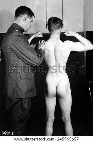 Physical examination of an aviation recruit\'s muscle development at the Episcopal Hospital, Washington, D.C. WWI. April 1918.
