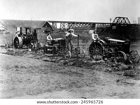 WWI Farmerettes driving tractors pulling plows. From 1917 to 1919, the Woman\'s Land Army of America brought more than 20,000 urban women to rural America replacing men called to war. Ca. 1918.
